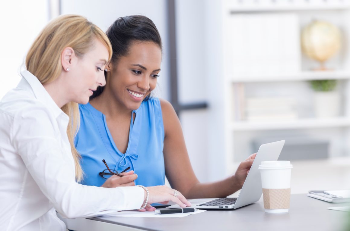 ladies working on laptop